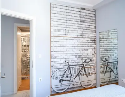 a bike is hanging on a brick wall at Tessera Alfa city apartment in Chania Town