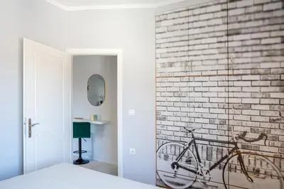 a bike parked against a brick wall in a bedroom at Tessera Alfa city apartment in Chania Town
