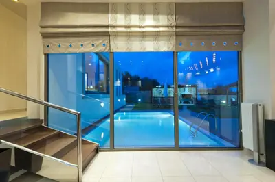 a view of a swimming pool from a building at Modern Interior Villa in Chania Town