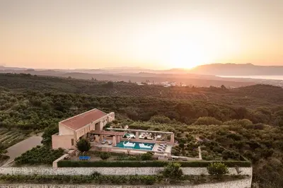 an aerial view of a villa with a swimming pool at Villa AnnaNiko, Luxury Villa, 2 Heated Pools, Jacuzzi, Gym, Stunning Views, Green Energy in Gerani Chanion