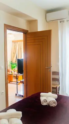 a bedroom with a bed with two towels on it at Melina's House in Chania Town