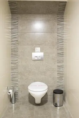 a bathroom with a white toilet in a room at Campagna Mare in Kissamos