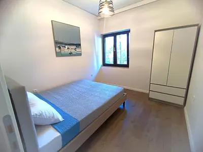 a small bedroom with a bed and a window at Casa Dina Nea Chora in Chania Town