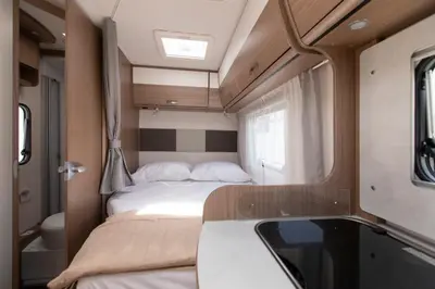 a small room with two beds in a rv at CamperLifeCrete in Chania Town