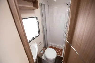 a small bathroom with a toilet and a sink at CamperLifeCrete in Chania Town