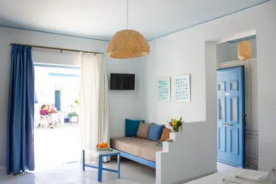 a living room with a couch and a table at Blue Calm in Daratso