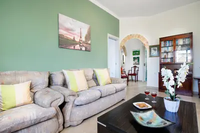a living room with a couch and a table at Irini Apartment I in Kalyves
