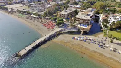 an aerial view of a beach with umbrellas at Irini Apartment I in Kalyves