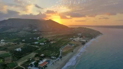 an aerial view of a beach at sunset at Irini Apartment I in Kalyves