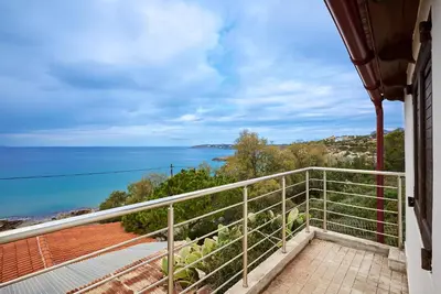 a balcony with a view of the ocean at Seaside House in Chania Town
