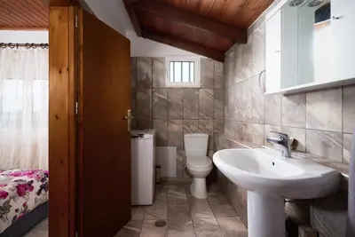 a bathroom with a sink and a toilet at Seaside House in Chania Town