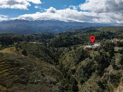 a red heart balloon flying over a mountain valley at Achlades The Mountain Paradise Villas - Suite with pool and balcony with amazing view! in Aletrouvárion