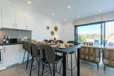 a kitchen and dining room with a table and chairs at Diktamos Villa by Vintage Travel in Tavronitis