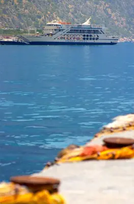 a cruise ship in the water with a large boat at Sweet Corner Masxali in Agia Roumeli