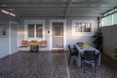 a room with a table and chairs and a table and a table and chairs at Haris home in Daratso