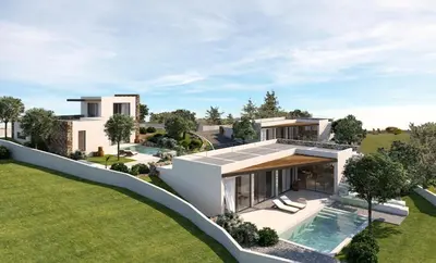 an aerial view of a house with a swimming pool at Studios Stylianos in Kounoupítsa
