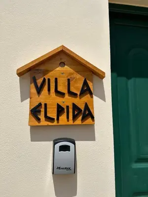 a wooden bird house on the side of a building at Villa Elpida Aspro in Koprána