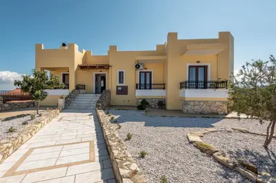 a villa with a view of the ocean at Sunlit sea view apartments in Stalos