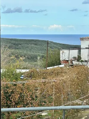 a view of the ocean from a hill at Elaiona Country Home in Xamoudhokhórion
