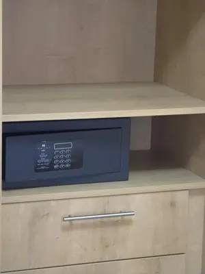 a microwave oven sitting on top of a cabinet at Breeze Apartment in Chania Town