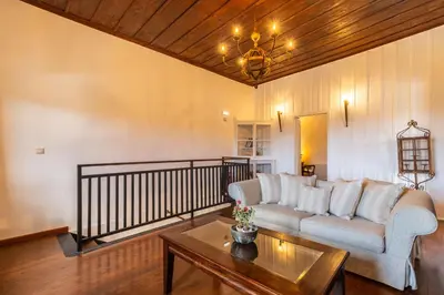 a living room with a couch and a coffee table at Villa Faye by PosarelliVillas in Metókhion
