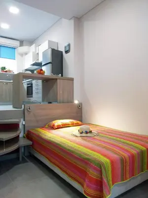 a bedroom with a bed with a stuffed animal on it at Dimitrios Cozy Apartment in Chania Town