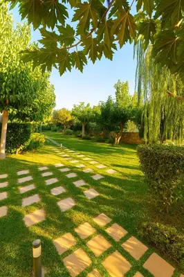 a garden with a stone path in the grass at Mear Luxury Holiday Homes - Cretan Sunny Gems in Kountoura Selino