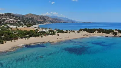 an aerial view of a beach with chairs and the ocean at Mear Luxury Holiday Homes - Cretan Sunny Gems in Kountoura Selino