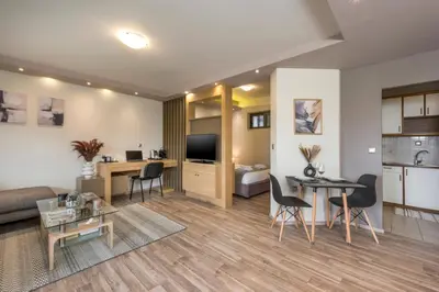 a living room with a couch and a table at Zen Luxury Studio in Kalamaki Chanion