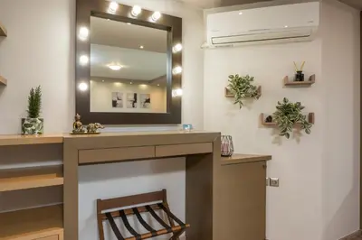 a bathroom with a sink and a mirror at Zen Luxury Studio in Kalamaki Chanion