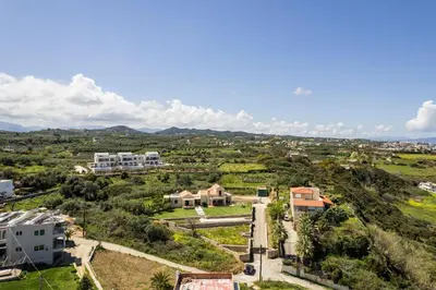 an aerial view of a city with houses and trees at Zen Luxury Studio in Kalamaki Chanion