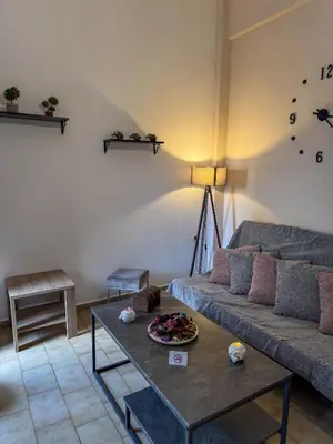 a living room with a couch and a table at Mike's appartments in Chania Town