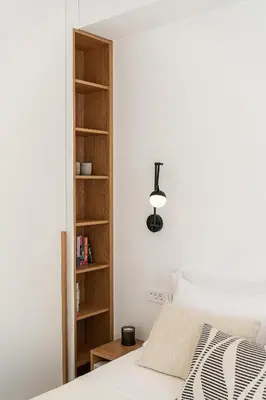 a bedroom with a bed and a book shelf at Villa Melista in Kounoupidhianá