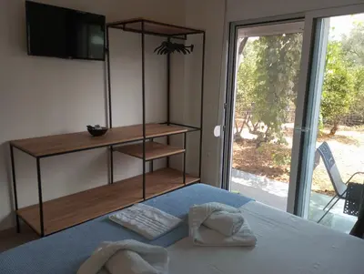 a bedroom with a bed with two towels on it at Silver Orb in Chania Town