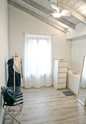 a dressing room with a dresser and a window at Serena Residence in Chania Town