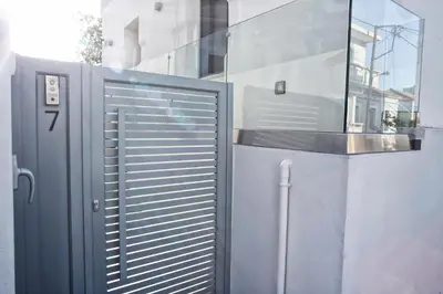 a metal gate in front of a building at Serena Residence in Chania Town