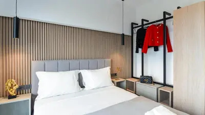 a bedroom with a large bed with white pillows at Seascape Luxury Apartment 2 in Kounoupidhianá