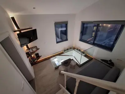 an overhead view of a living room with a glass table at Blue Balcony - Boutique Beachfront Suite with Private Parking Spot in Chania Town