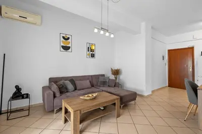 a living room with a couch and a table at Marika's Apartment in Chania in Chania Town