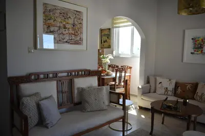 a living room with a couch and a table at Diotima - Astonishing seaview apartment in Chania Town