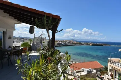 a balcony of a house with a view of the ocean at Diotima - Astonishing seaview apartment in Chania Town