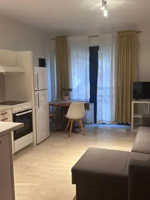 a kitchen and living room with a couch and a table at Elias Nest in Galatás