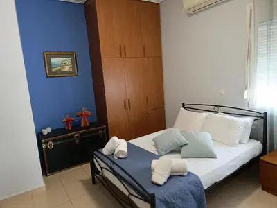 a bedroom with a bed with towels on it at Del's Apartment in Chania Town