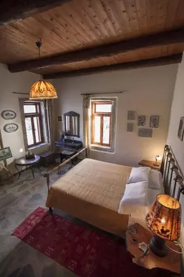 a bedroom with a large bed in a room at Kallimento-Dimitra in Kissamos