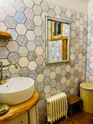 a bathroom with a sink and a mirror at WHITE MOUNTAINS Nature Home in Arménoi