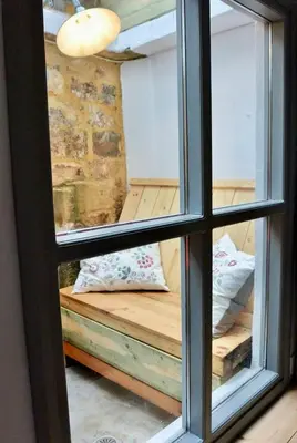 a window view of a room with a bench through it at Casa Di Porto Vecchio in Chania Town