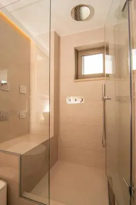 a shower with a glass door in a bathroom at Diktamo apartment, Palaiochora in Palaiochóra