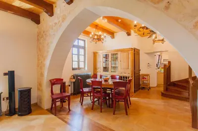 a kitchen and dining room with a table and chairs at Luxurious Venetian 3 FLOOR HOUSE in the old port in Chania Town