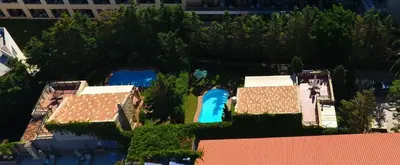 an overhead view of a house and a swimming pool at Rock House's Villa Melody in Plataniás