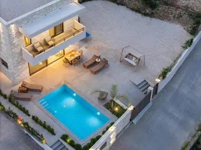 an aerial view of a house with a swimming pool at Feli Living in Spiliá